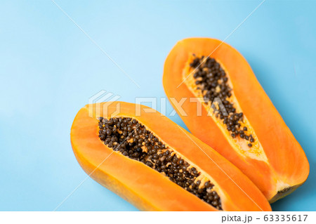 Ripe papaya on blue background 63335617