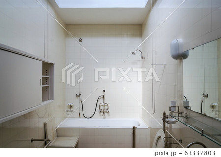 Beautiful shower bath tub in modern functionalism bathroom, white tile design wall 63337803