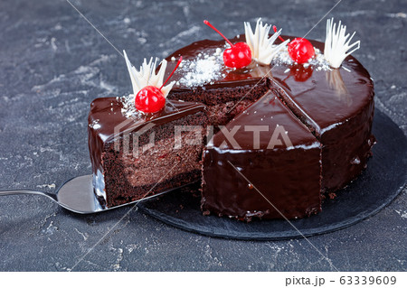 Moist chocolate brownie cake with cherry filling Moist chocolate brownie cake with cherry filling 63339609