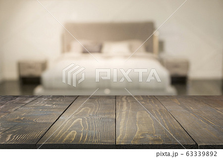 Empty wooden board and blurred modern bedroom with house interior as background. Abstract pattern. 63339892
