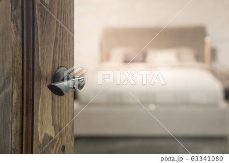 Open wooden door and view to bedroom. Open wooden door and view to bedroom. 63341080
