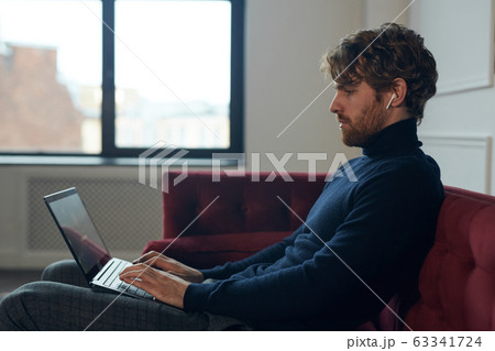 Side View at Handsome Man Using Laptop Side View at Handsome Man Using Laptop 63341724