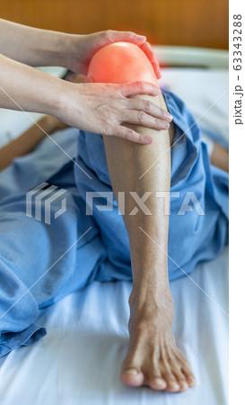 Knee injury and joint pain in elderly patient under doctor surgical medical exam, physiotherapy and treatment from osteoporosis, bone disease or leg joint surgery 63343288
