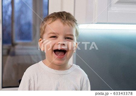Сute emotional boy in the kitchen Сute emotional boy in the kitchen 63343378