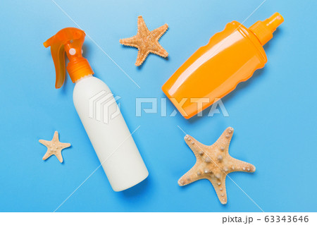 sunscreen cream with starfish and seashells in 63343646