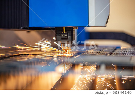 CNC Laser cutting of metal, modern industrial 63344140