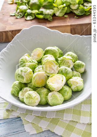 Fresh brusseles sprouts in bowl on kitchen table 63344595