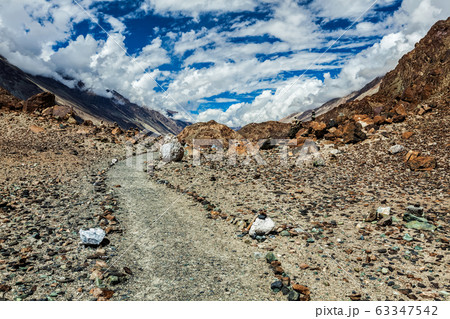 Foot path to sacred lake Lohat Tso in Himalayas. Nubra valley, Ladakh, India Foot path to sacred lake Lohat Tso in Himalayas. Nubra valley, Ladakh, India 63347542