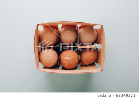 Farm organic eggs in wooden basket Farm organic eggs in wooden basket 63349273