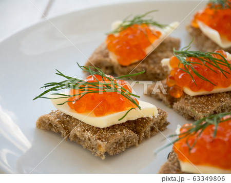 Canapes with red caviar and butter closeup Canapes with red caviar and butter closeup 63349806