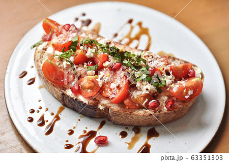 Bruschetta italian appetizer food, Crusty toasting bread with fresh tomato 63351303