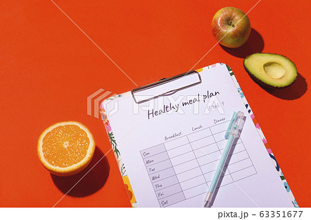 A table with a weekly nutrition plan. The concept A table with a weekly nutrition plan. The concept 63351677