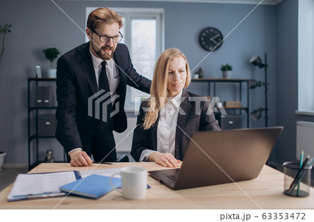 Business partners having consultation at modern office Business partners having consultation at modern office 63353472
