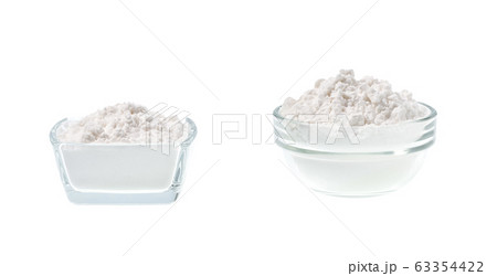 Glass plate with potato starch isolated on a white 63354422