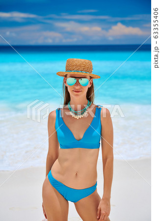 Woman on beach at Seychelles Woman on beach at Seychelles 63355406