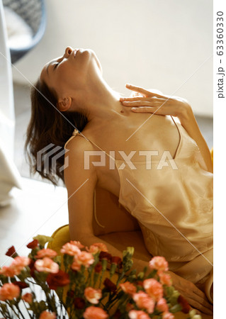 Sensual woman in her bedroom on sunset Sensual woman in her bedroom on sunset 63360330