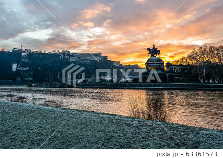Colorful Sunrise burning sky Koblenz City historic monument German Corner where river rhine and mosele flow together 63361573