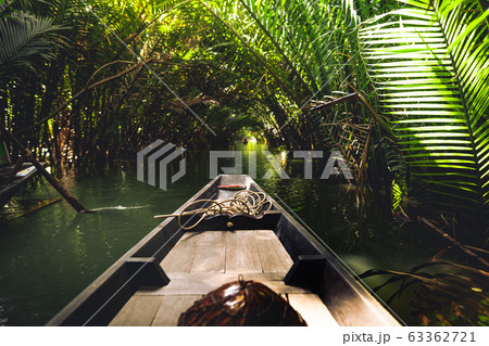 Travel on a wooden boat in the floating market. 63362721