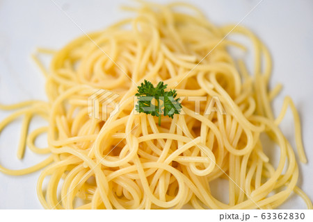 Spaghetti italian pasta served on white plate and Spaghetti italian pasta served on white plate and 63362830