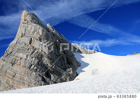 Glacier with rocks in Austria with snow and blue sky 63365880