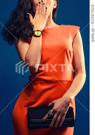 Fashionable woman in red evening dress with a 63367028