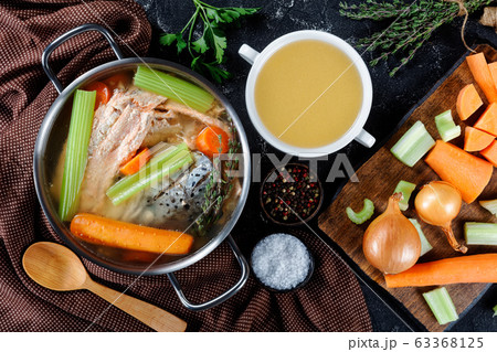 fish broth of salmon, onion, carrots, celery fish broth of salmon, onion, carrots, celery 63368125