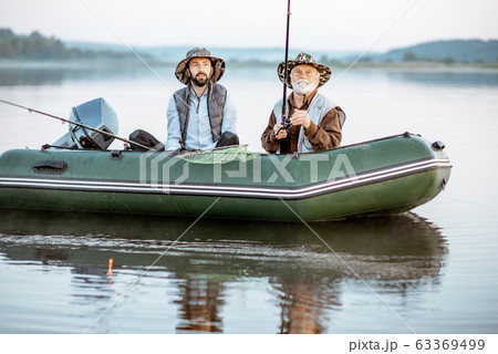 Grandfather with son fishing on the boat 63369499