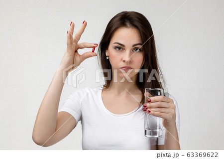 young sad woman suffering from tooth pain young sad woman suffering from tooth pain 63369622