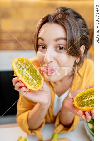 Young woman with healthy fresh food on the kitchen 63371440