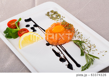 Raw salmon tartare 63374326