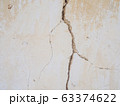 Cement concrete wall was cracked, beige color paint peel.  63374622
