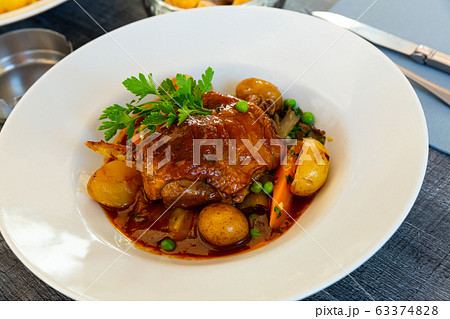 Braised duck leg with vegetables Braised duck leg with vegetables 63374828