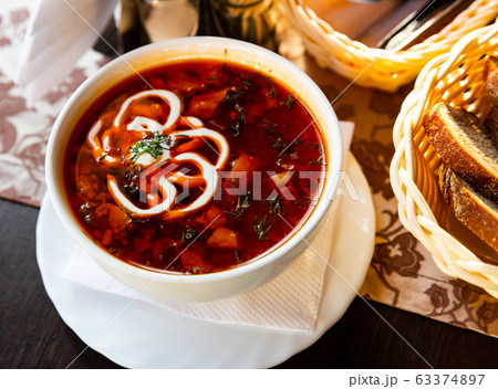 Russian cuisine - solyanka soup with various ingredients 63374897