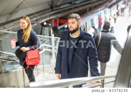 People climbing stairs 63378230