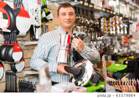 Man buying household appliances 63379864