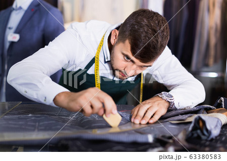 Handsome guy snipper in modern workshop Handsome guy snipper in modern workshop 63380583