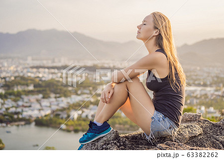 Woman tourist on the background of Nha Trang city. Travel to Vietnam Concept 63382262