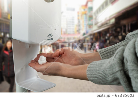 Disinfectant for hands in a public place during the coronavirus pandemic 63385602