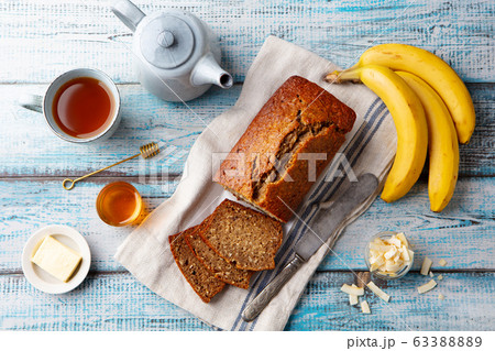 Healthy vegan oat and banana loaf bread, cake. Blue wooden background. Top view. 63388889