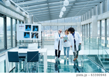 Group of doctors talking about corona virus on conference, midsection. Group of doctors talking about corona virus on conference, midsection. 63390948
