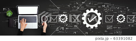 Quality control approval with person using laptop computer Quality control approval with person using laptop computer 63391082