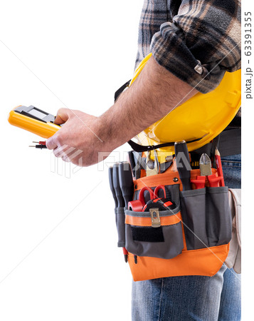 Electrician with tool belt on a white background. 63391355