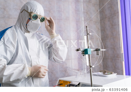 Doctor in protective suit at pandemic period 63391406