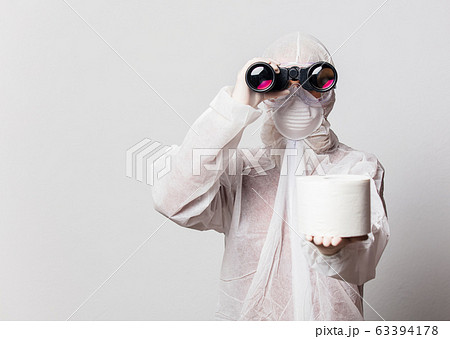 young doctor in protection suit and glasses with 63394178