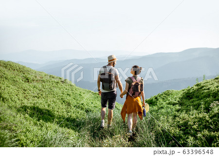 Couple traveling in the mountains Couple traveling in the mountains 63396548