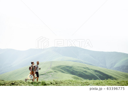 Couple traveling in the mountains Couple traveling in the mountains 63396775
