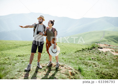 Couple traveling in the mountains Couple traveling in the mountains 63396793