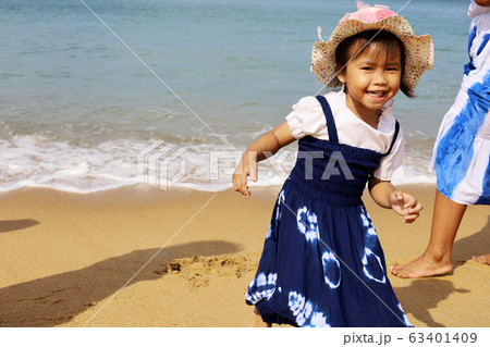 Beautiful Asia young woman smile portrait on the beach in summer at Phuket, Thailand. 63401409