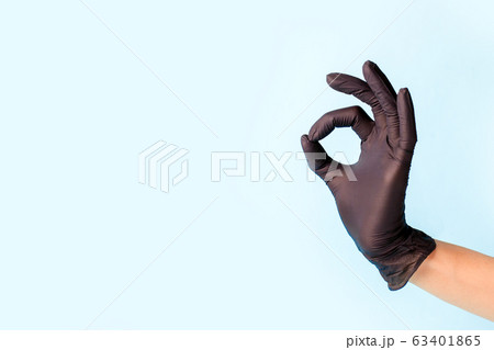 Female hand in cosmetology medicine black glove Female hand in cosmetology medicine black glove 63401865