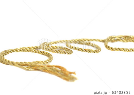 Golden rope isolated on white background Golden rope isolated on white background 63402355